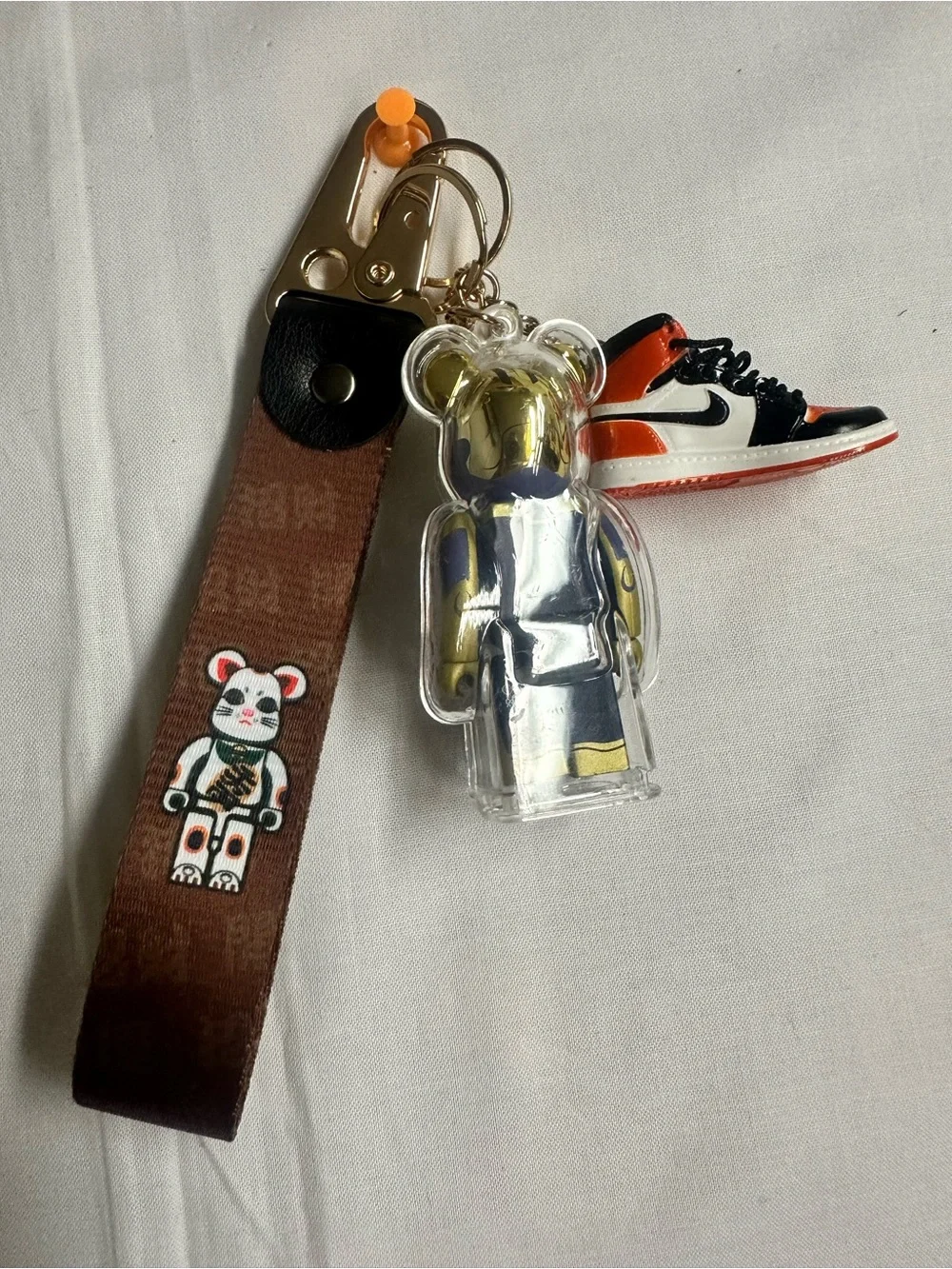 Gold & Purple Bear Keychain with Orange-Black Sneaker Charm